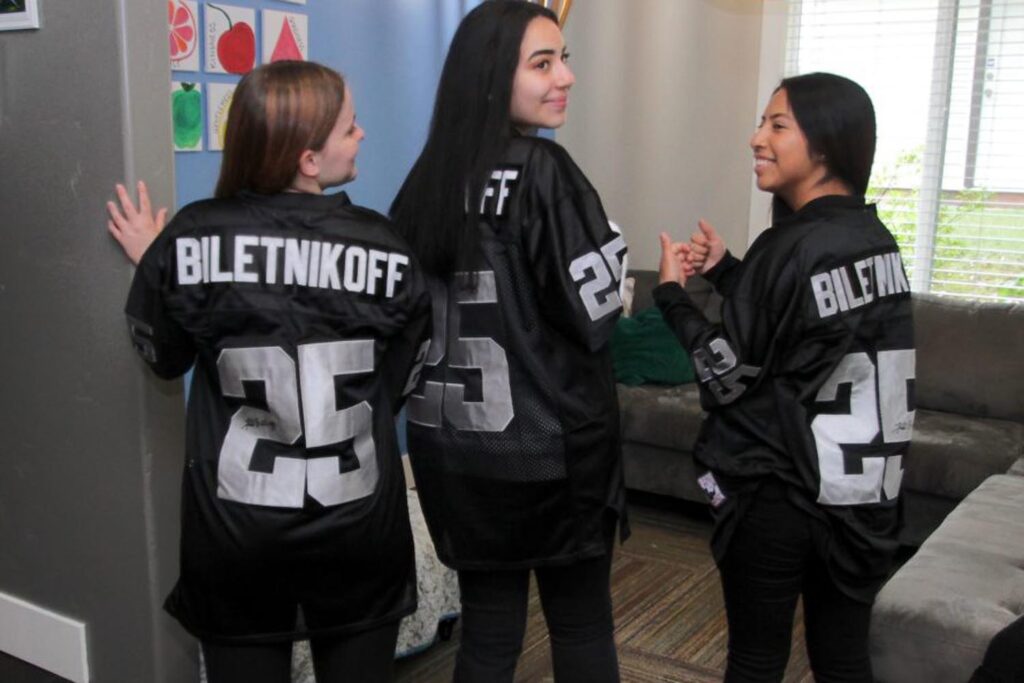 Visitors at the The Biletnikoff Center of Hope wearing #25 Biletnikoff Raiders jerseys.